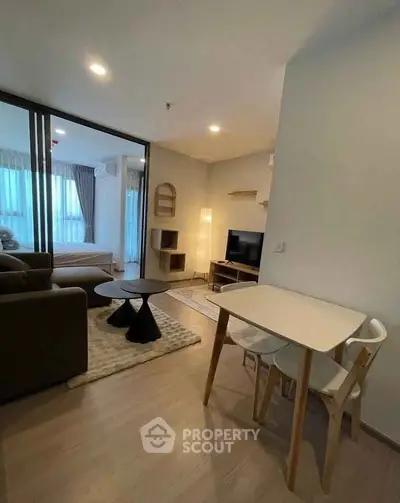 Modern living room with stylish furniture and open layout in a cozy apartment.