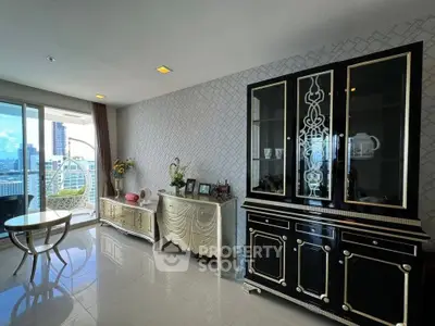 Elegant living room with stylish furniture and city view balcony in modern apartment.