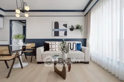 Modern living room with stylish decor and large windows for natural light.