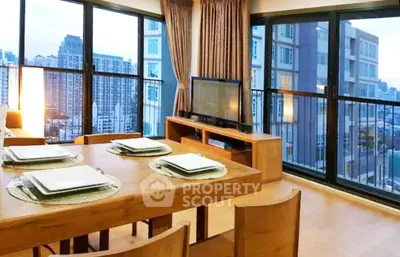 Spacious modern living room with city view and elegant dining area