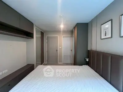 Modern bedroom with sleek design and ample storage space