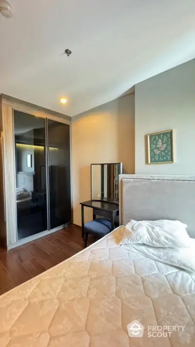 Cozy bedroom with modern wardrobe and elegant vanity set