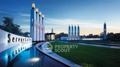 Luxurious modern building entrance with elegant architectural design and serene landscaping.