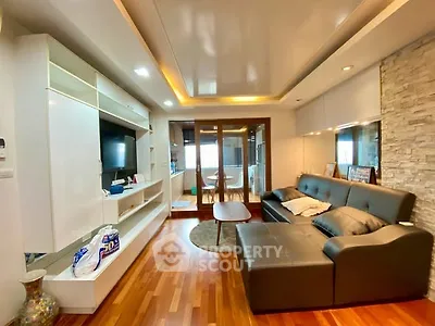 Modern living room with sleek design and cozy seating area