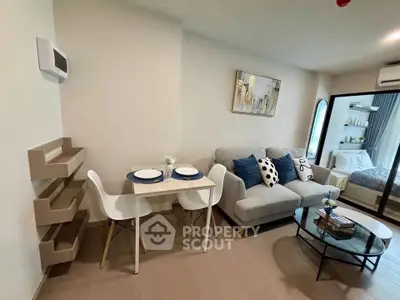 Modern living room with cozy seating and dining area in stylish apartment