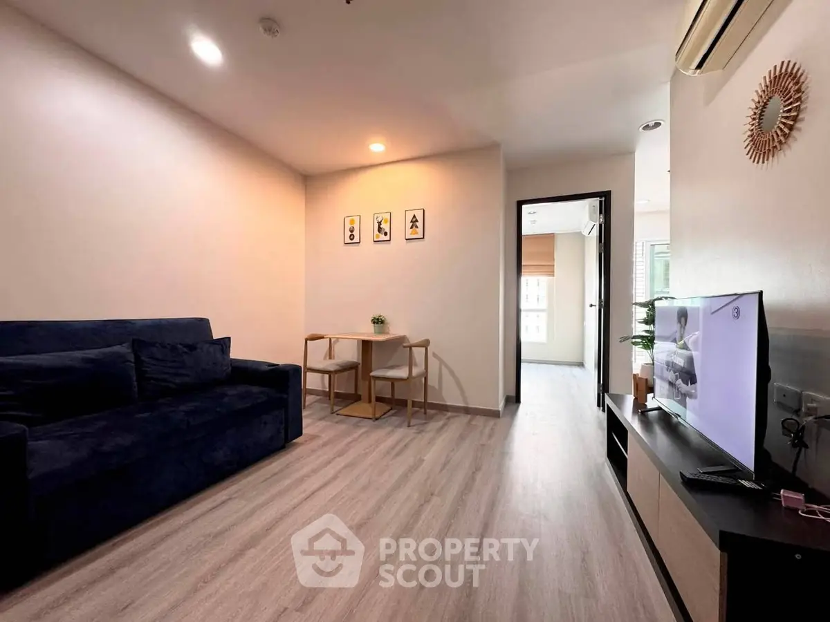 Modern living room with sleek furniture and stylish decor, perfect for urban living.