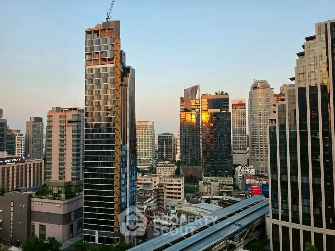 Stunning cityscape view showcasing modern high-rise buildings at sunset, perfect for urban living enthusiasts.