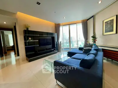 Spacious modern living room with large windows and elegant decor