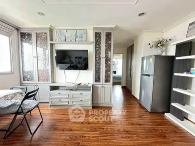 Modern living room with wooden flooring and sleek furniture design