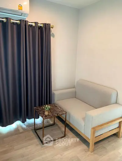 Cozy living room corner with modern sofa and elegant curtains