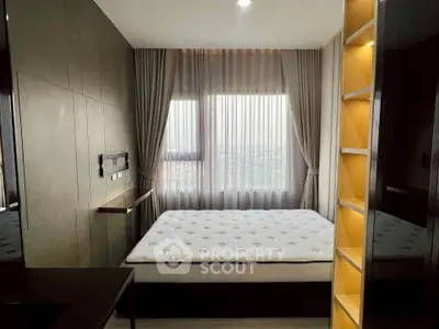 Modern bedroom with large window and elegant curtains, featuring a comfortable bed and sleek design.