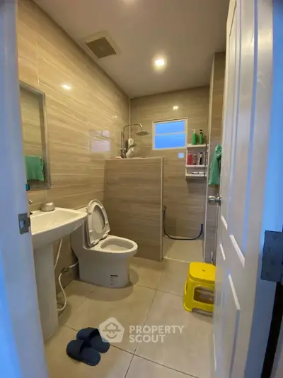 Modern bathroom with sleek tiles and open shower design