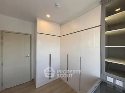 Modern bedroom with built-in wardrobes and sleek design