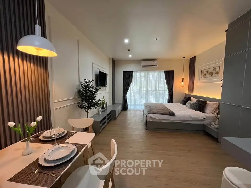 Modern studio apartment with open layout, stylish decor, and natural light.