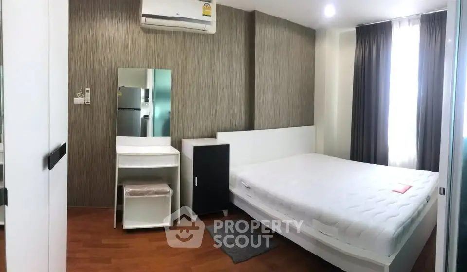 Modern bedroom with minimalist design and ample natural light