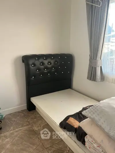 Cozy bedroom with elegant headboard and natural light