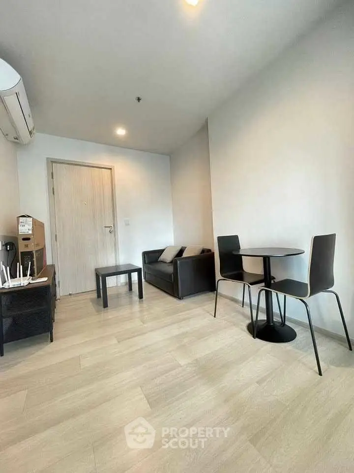 Modern living room with minimalist furniture and wooden flooring