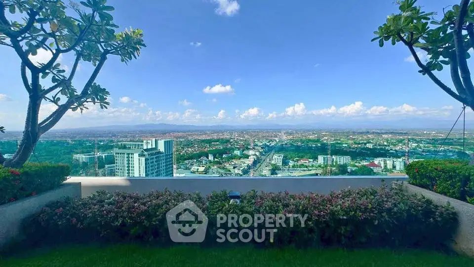 Stunning panoramic city view from a lush garden balcony, perfect for relaxation and enjoying urban landscapes.