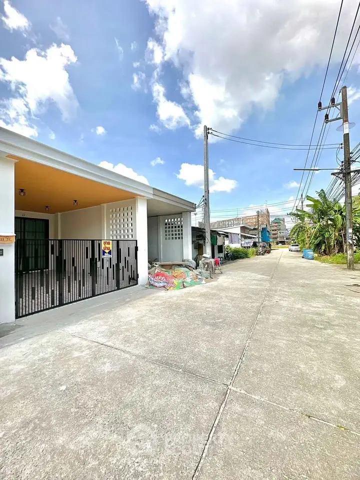 Charming suburban home with spacious driveway and modern exterior design in a peaceful neighborhood.