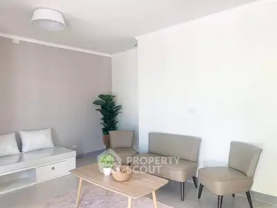 Modern living room with beige furniture and minimalist decor