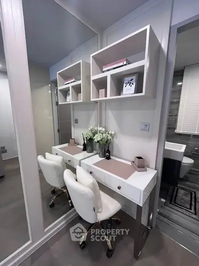 Elegant modern bathroom with stylish vanity and plush seating