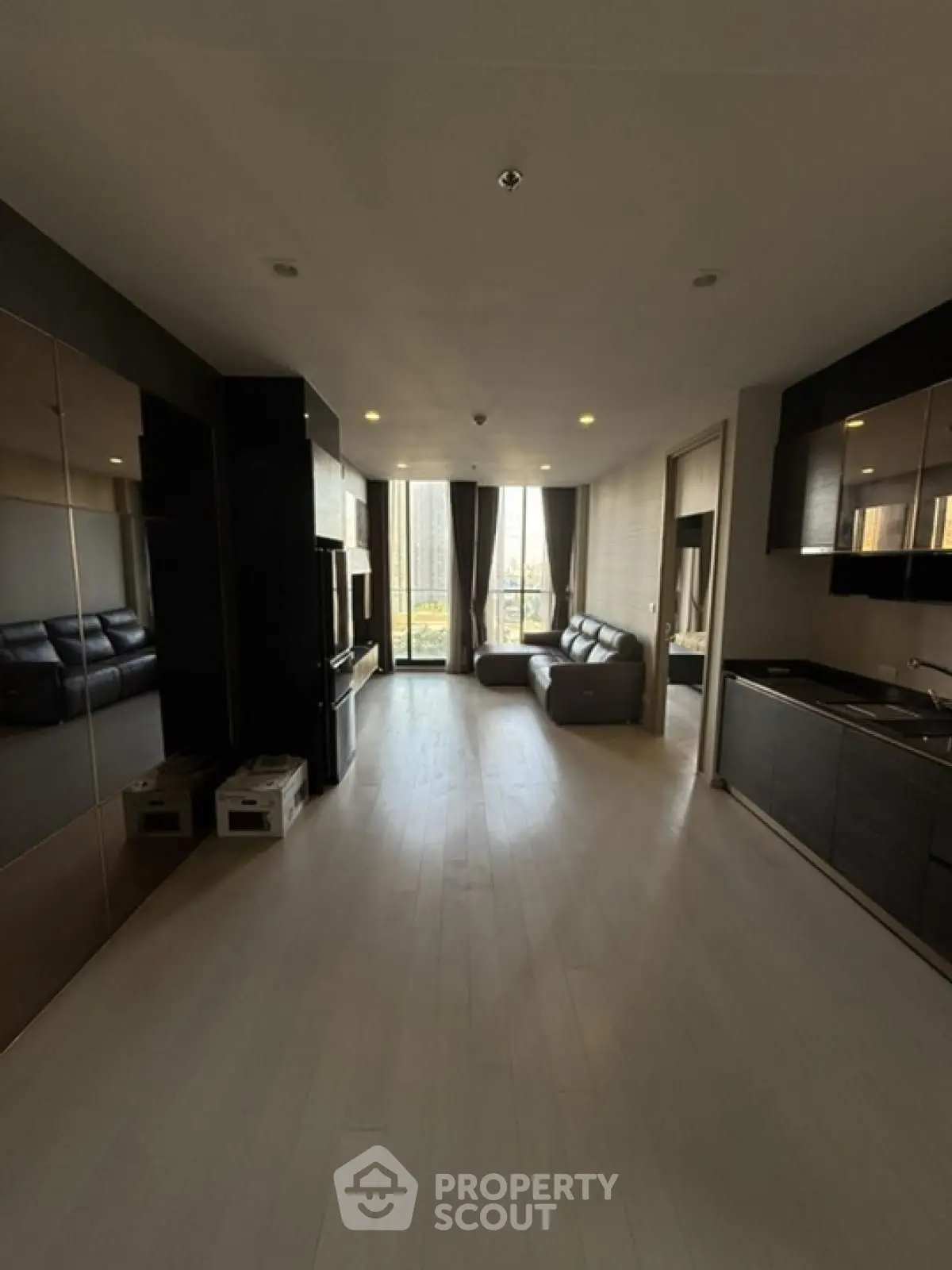 Spacious modern living room with open kitchen and large windows