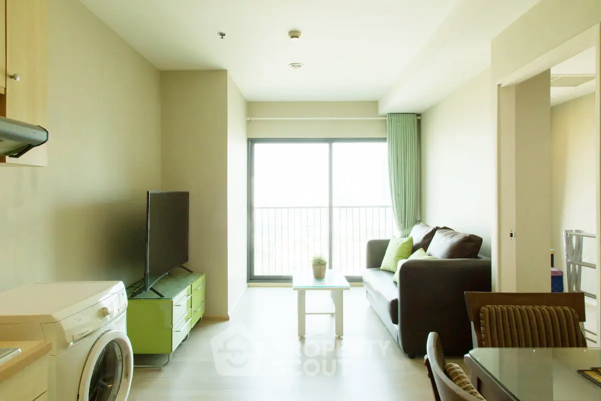 Bright and modern living room with balcony access in a stylish apartment.