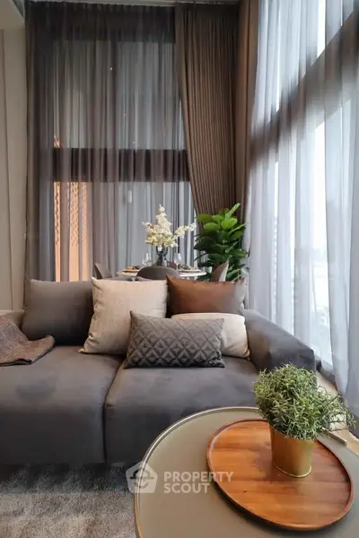 Luxurious living room with plush sofa and elegant decor in modern apartment