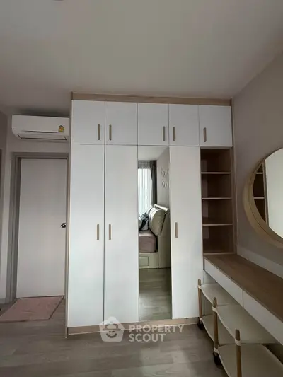 Modern bedroom with sleek wardrobe and stylish decor
