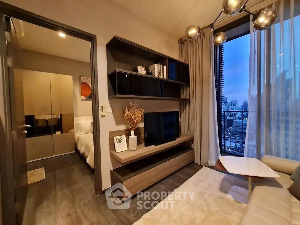 Modern living room with elegant shelving and city view from balcony, featuring stylish lighting and cozy decor.