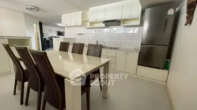 Spacious kitchen with dining area and modern appliances