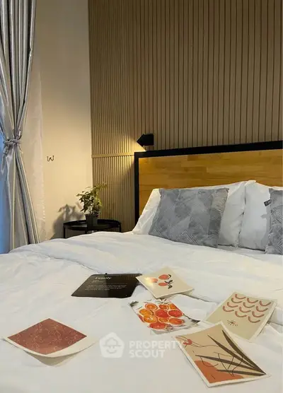 Stylish bedroom with modern decor and cozy bedding, perfect for relaxation.