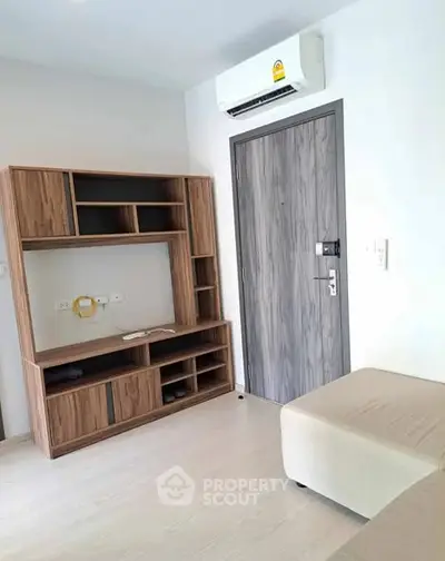 Modern living room with wooden furniture and air conditioning unit