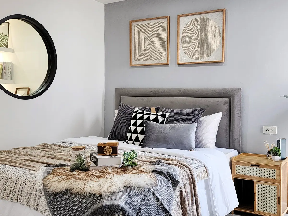 Stylish modern bedroom with cozy decor and geometric wall art