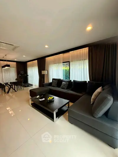 Luxurious modern living room with sleek furniture and ambient lighting