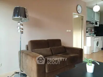 Cozy living room with modern brown sofa and stylish floor lamp