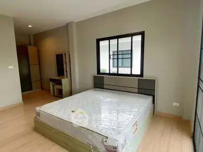 Spacious bedroom with modern design and natural light