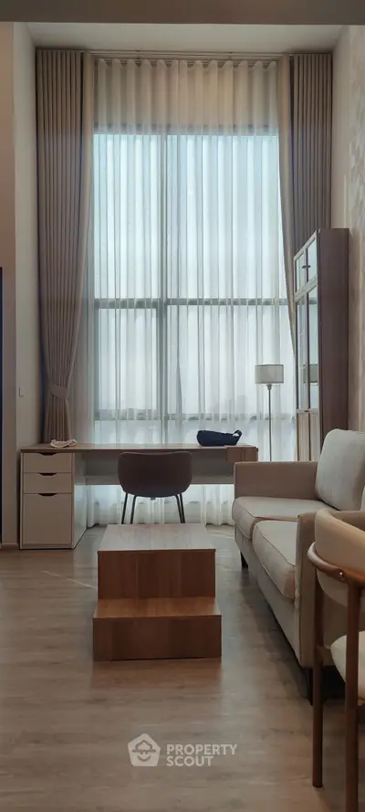 Elegant living room with high ceilings and modern furniture