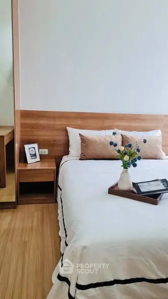 Modern bedroom with wooden accents and elegant decor