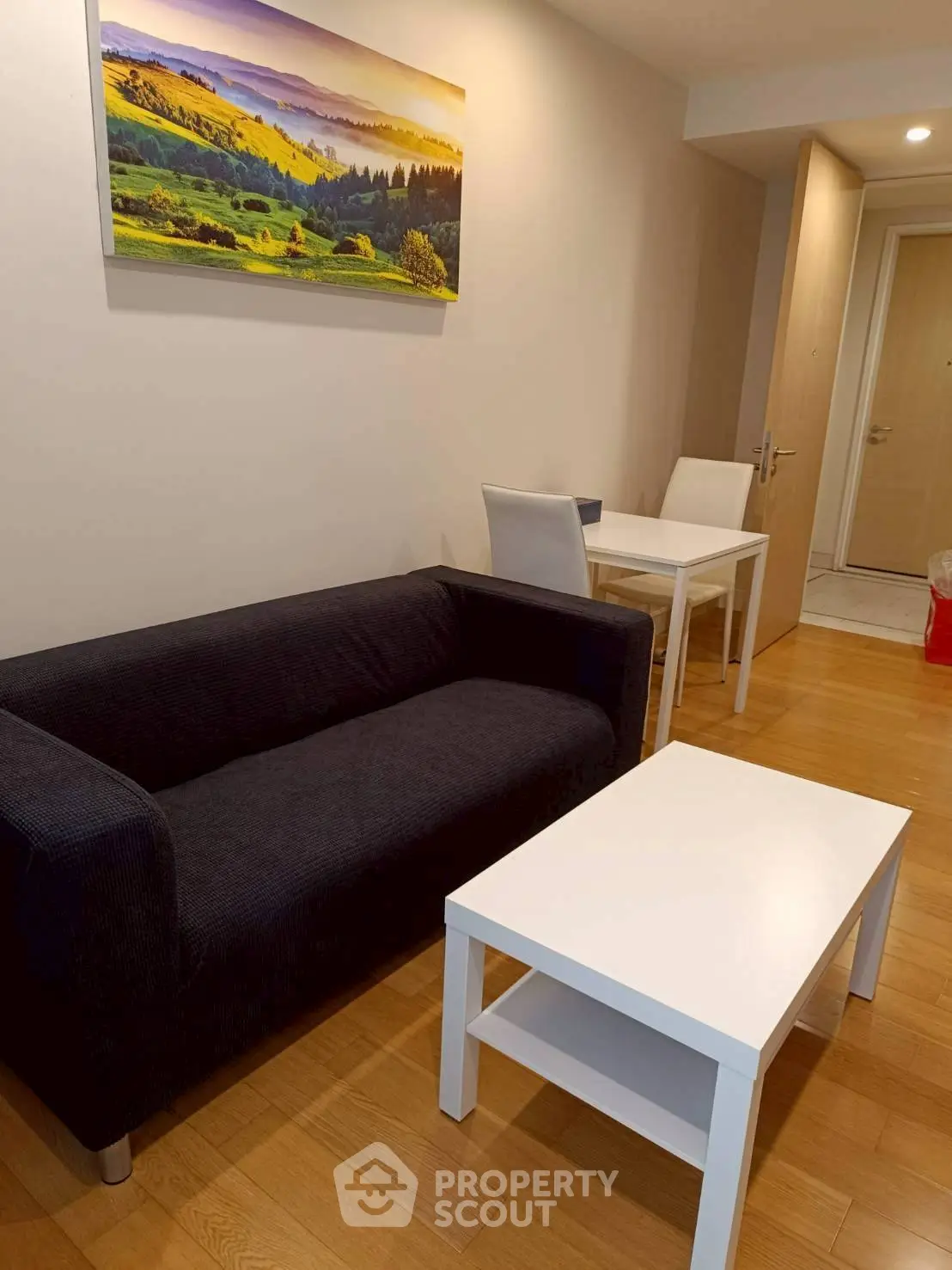 Cozy living room with modern furniture and scenic wall art