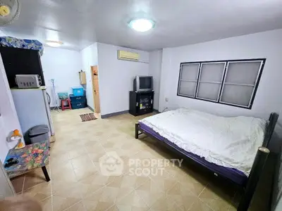 Spacious bedroom with modern amenities and ample natural light