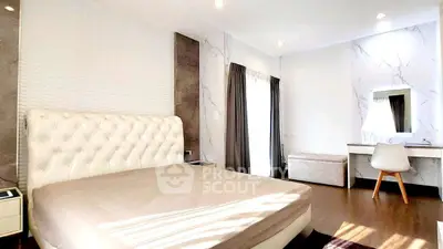 Luxurious bedroom with elegant decor and natural light