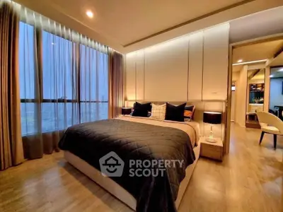 Luxurious modern bedroom with floor-to-ceiling windows and elegant decor.