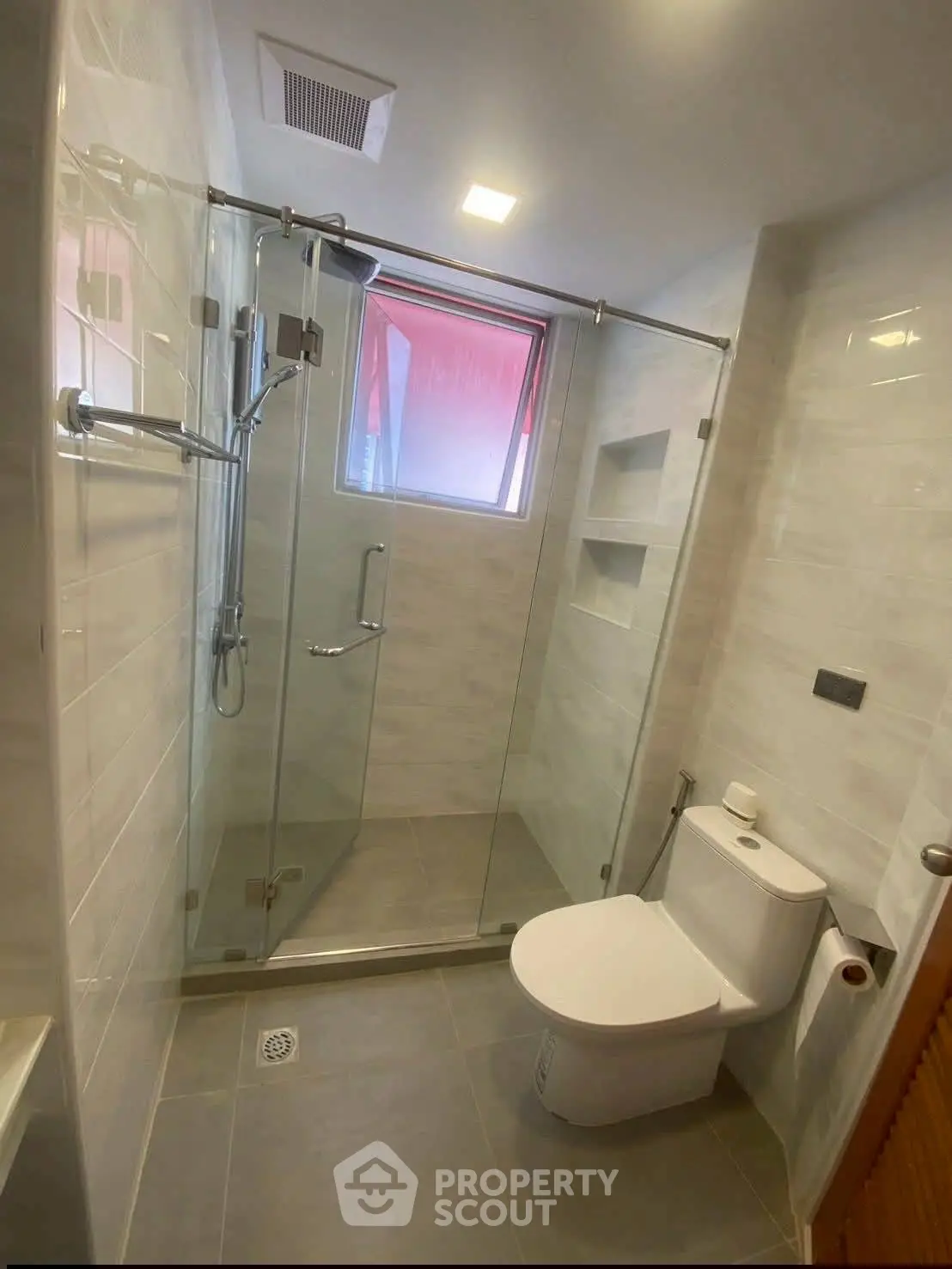 Modern bathroom with glass shower and sleek fixtures