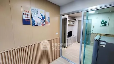 Modern apartment interior with sliding glass door and stylish decor