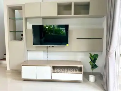 Modern living room with sleek TV unit and stylish decor