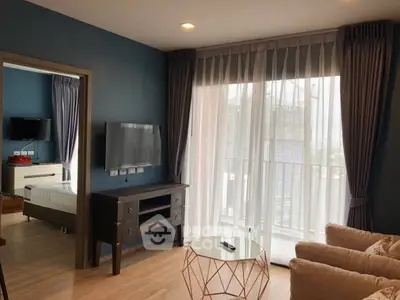 Modern living room with balcony access and stylish decor