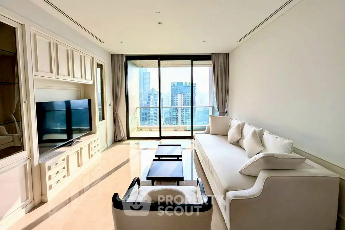 Luxurious living room with city view, elegant furniture, and floor-to-ceiling windows in high-rise apartment.