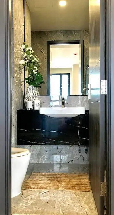 Luxurious modern bathroom with elegant marble finishes and stylish decor