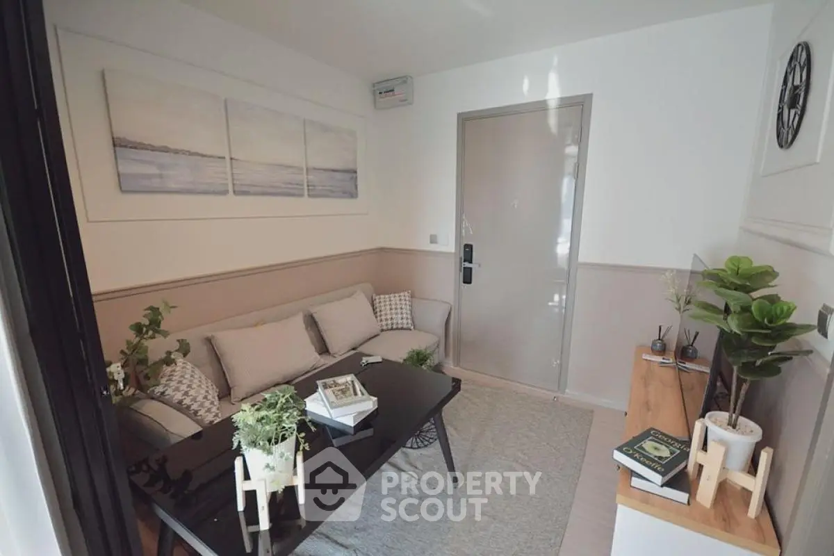 Cozy living room with modern decor and neutral tones, perfect for relaxation and entertaining.